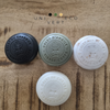 Le galet masque solide visage et corps au lait d'ânesse bio et au charbon noir : le lait d'ânesse va préserver la peau du dessèchement, le charbon noir va avoir une action détoxifiante. Le galet masque au lait d'ânesse bio et aux algues vont jouer un rôle exfoliant.  Au lait d'ânesse bio et à l'argile verte lutte contre les excès de sébum qui rendent la peau grasse. Celui au lait de chèvre aide la peau à lutter contre les imperfections , l'argile blanche nourrit la peau.